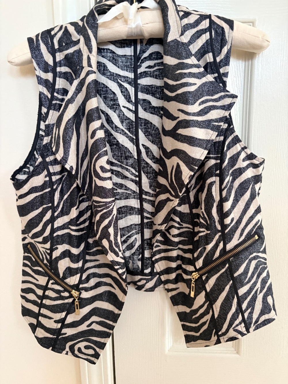 Chico's brand zebra pattern vest featuring moto-inspired diagonal zip pockets .